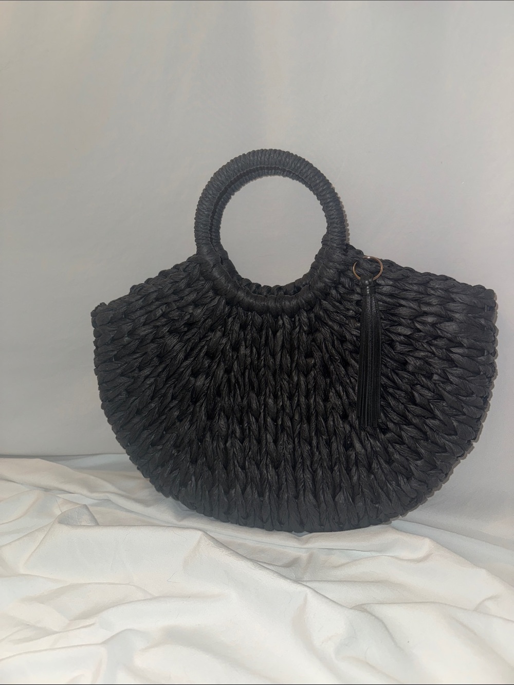 Black Handwoven Round-Handle Tote with Tassel Accent